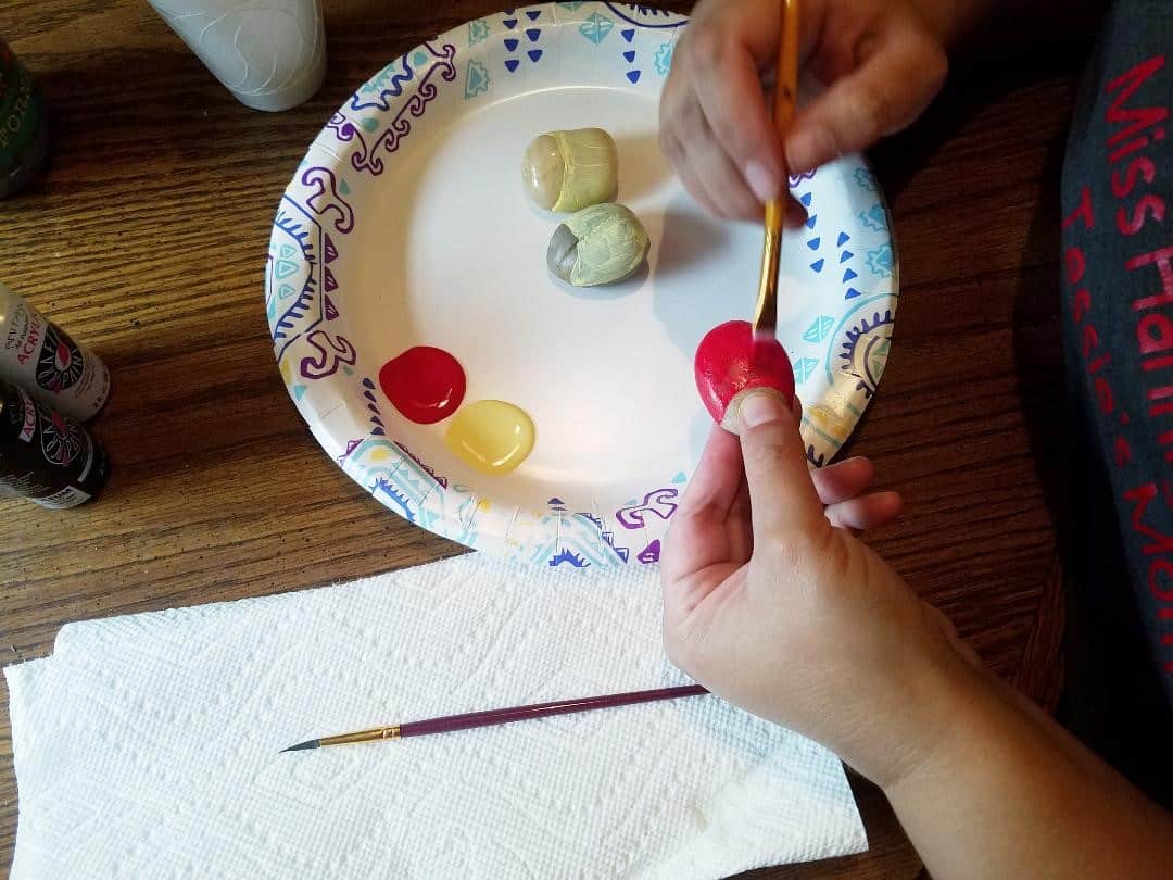 How to Paint a Ladybug on a Rock - Painting a base coat on your rocks
