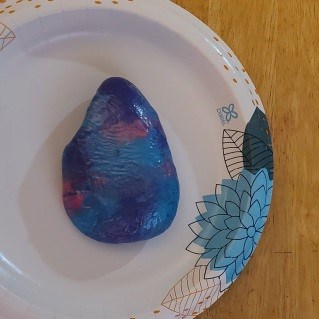 Let saran wrap painted rock dry
