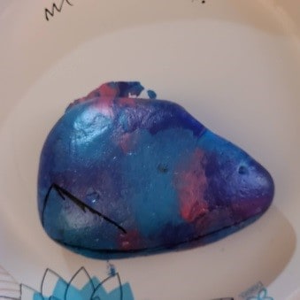Saran wrap painted rock add detail 1