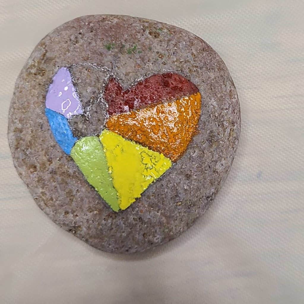 Painting the heart rock - green, blue, violet