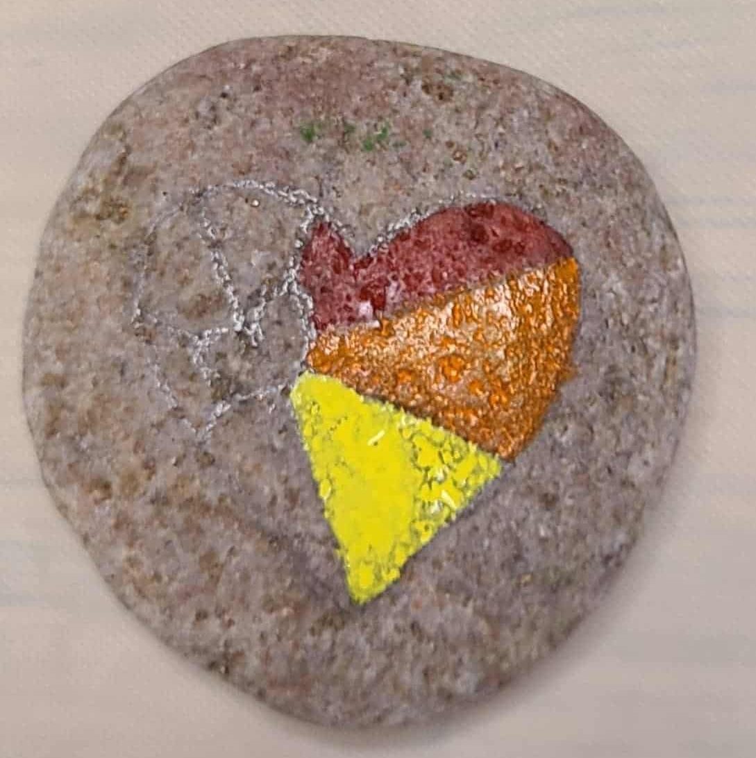 Painting the heart rock - yellow