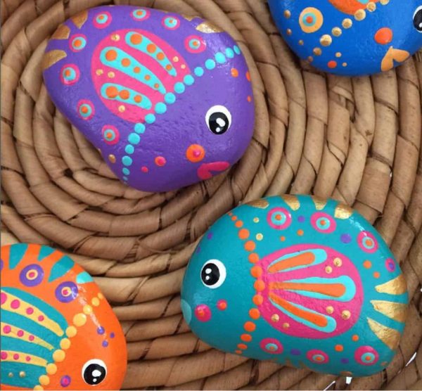 Fish painted rocks by cara.dura.designs