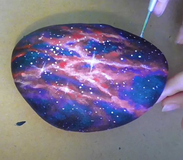 Painting Galaxy On Rock by Tatiana Urbankova