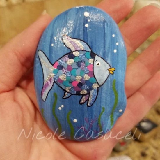 Rainbow Fish painted Rock by Nicole Casaceli