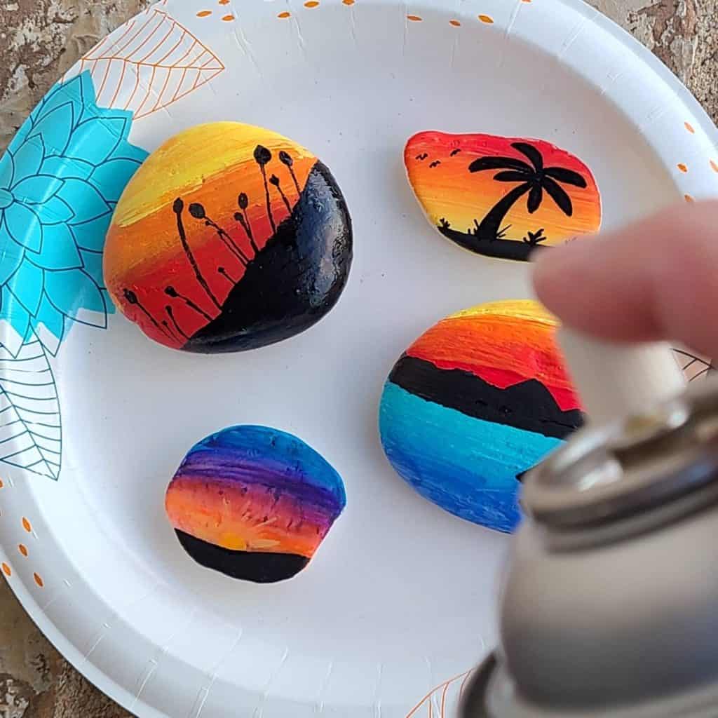 sunset painted rocks sealing rocks