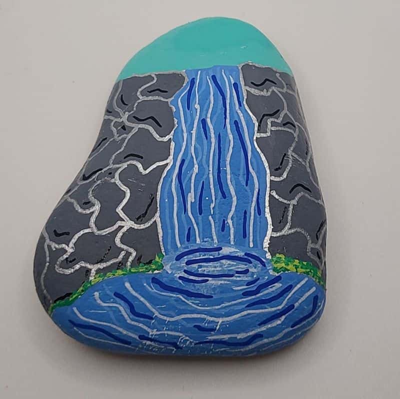 paint a waterfall on a rock design 2d