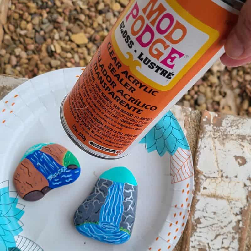 paint a waterfall on a rock sealing rocks