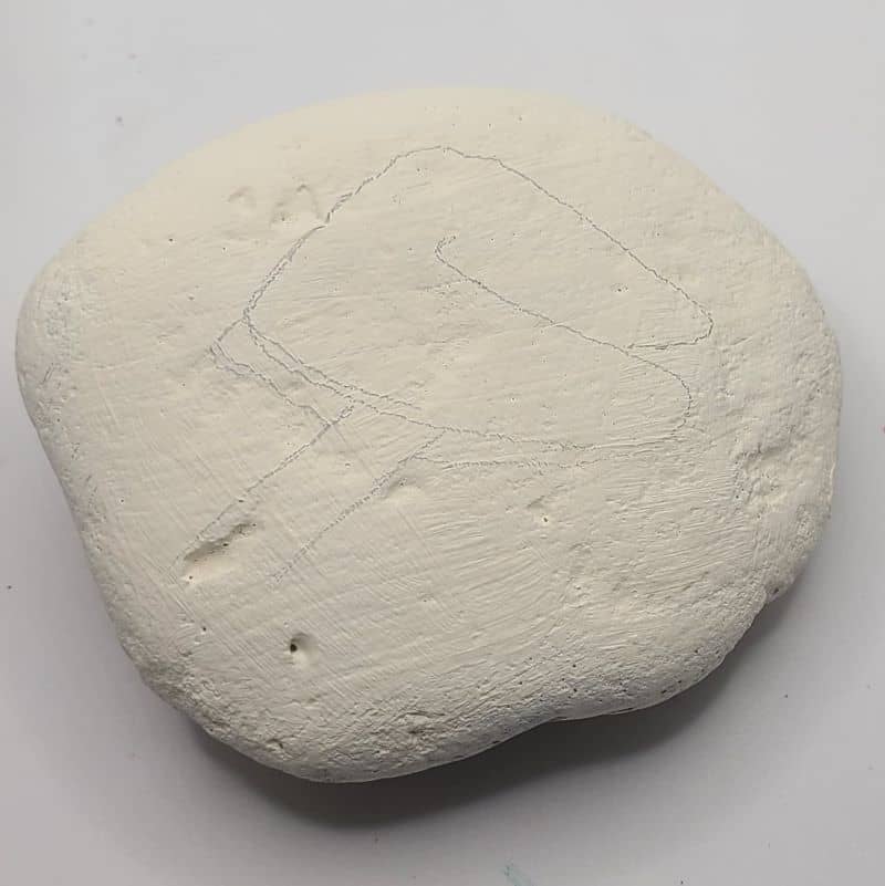 Drawing fortune cookie on a rock