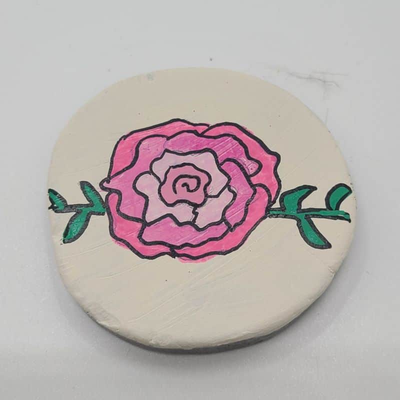 rose painted rocks adding detail 2