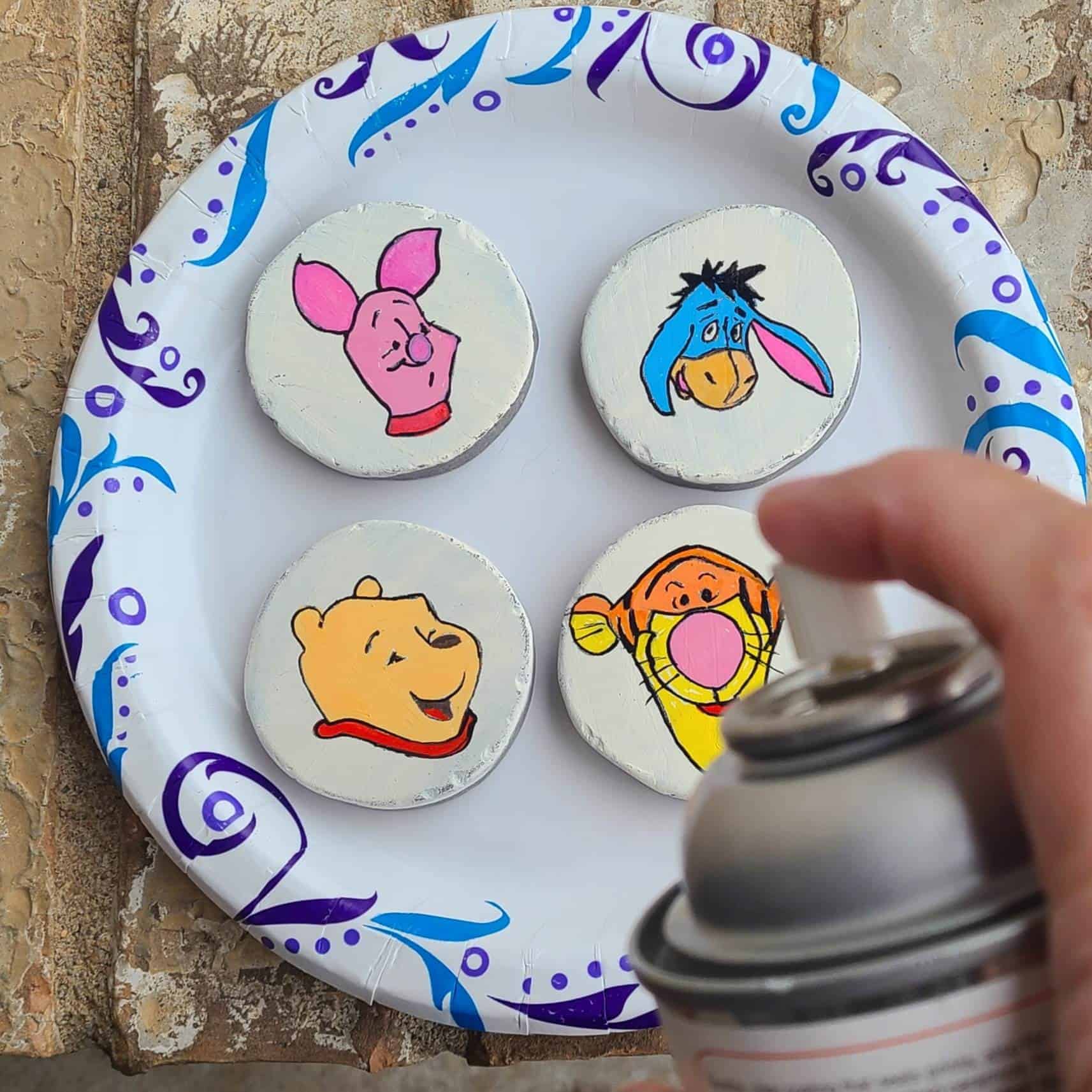 winnie the pooh painted rocks - sealing the rocks