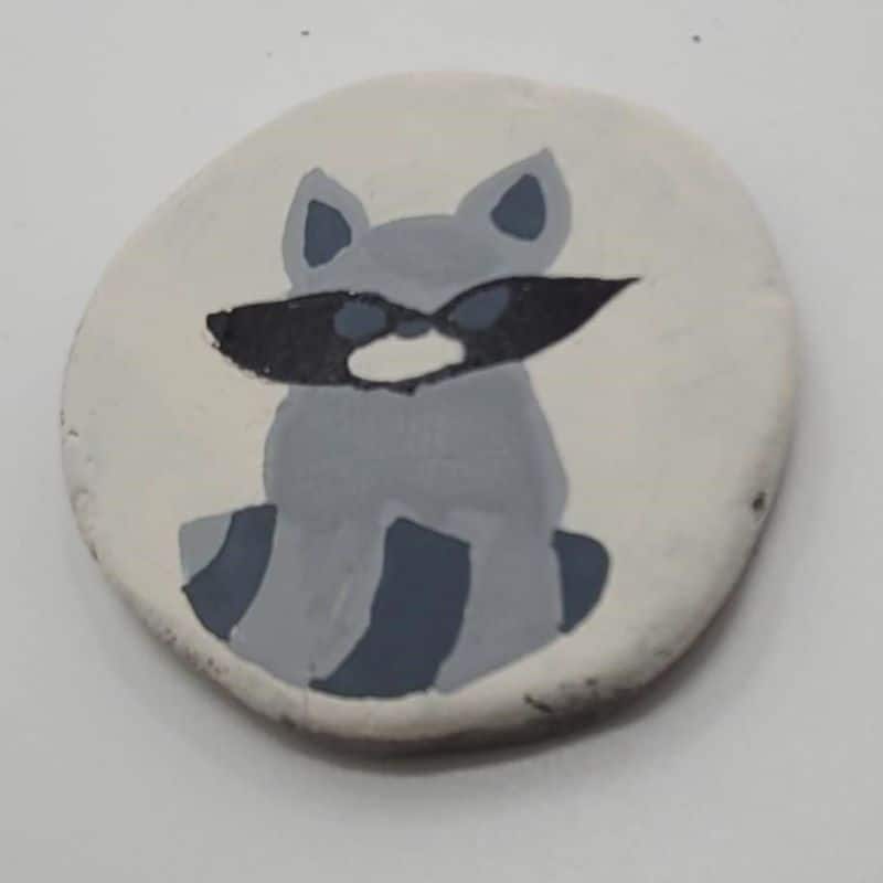forest animal painted rocks - painting the raccoon