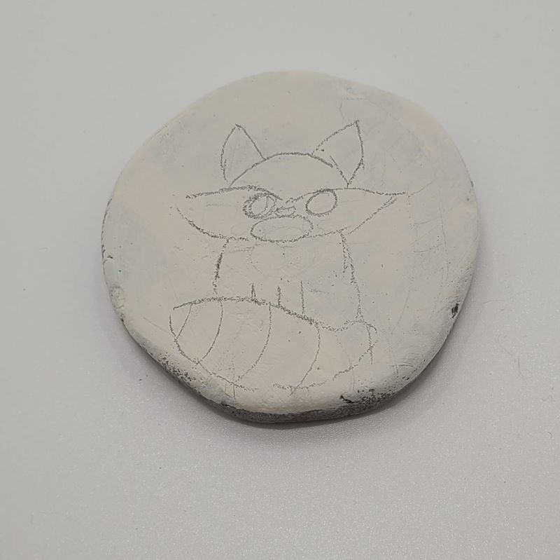 forest animal painted rocks - pencil drawing the raccoon