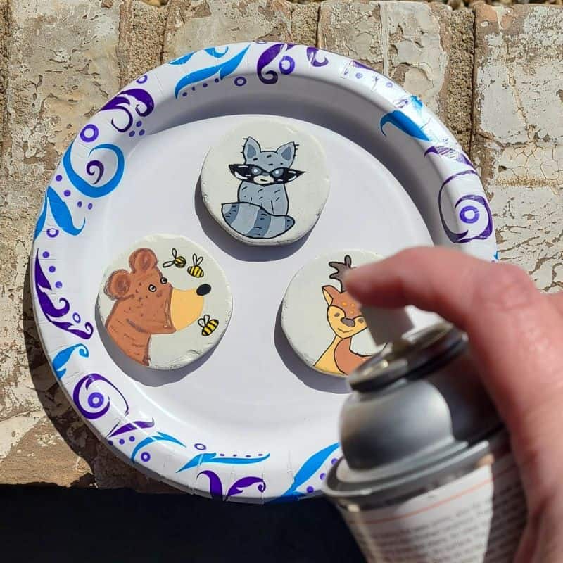 forest animal painted rocks - sealing the painted rocks