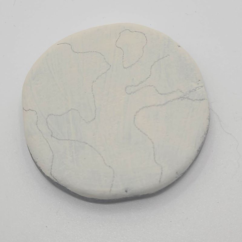 Outlining the continents and oceans in pencil